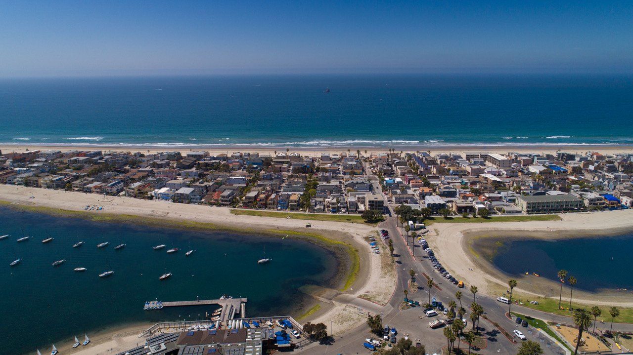 An aerial view of a beach and a body of water.