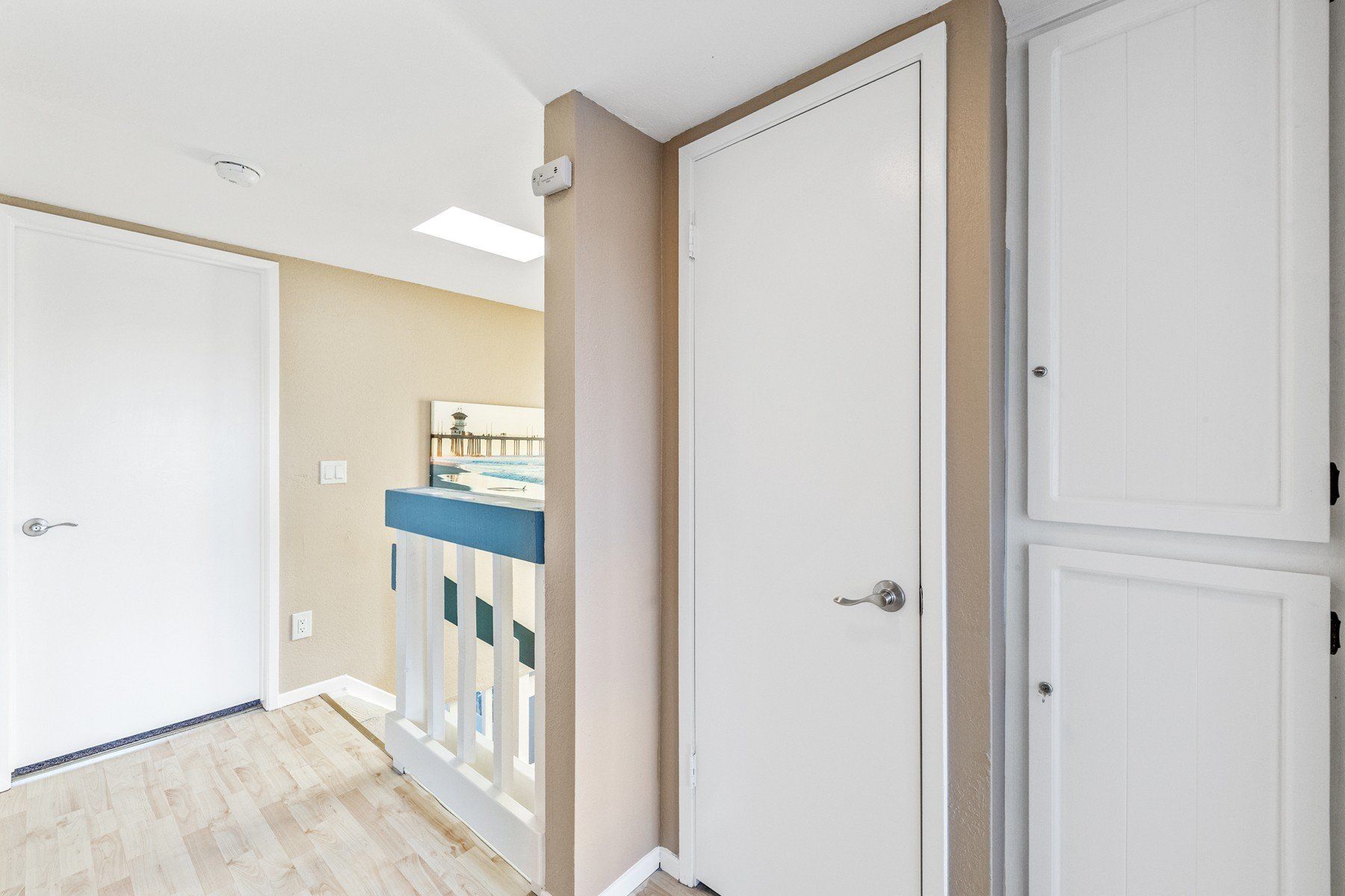 a hallway with a staircase leading up to the second floor of a house .