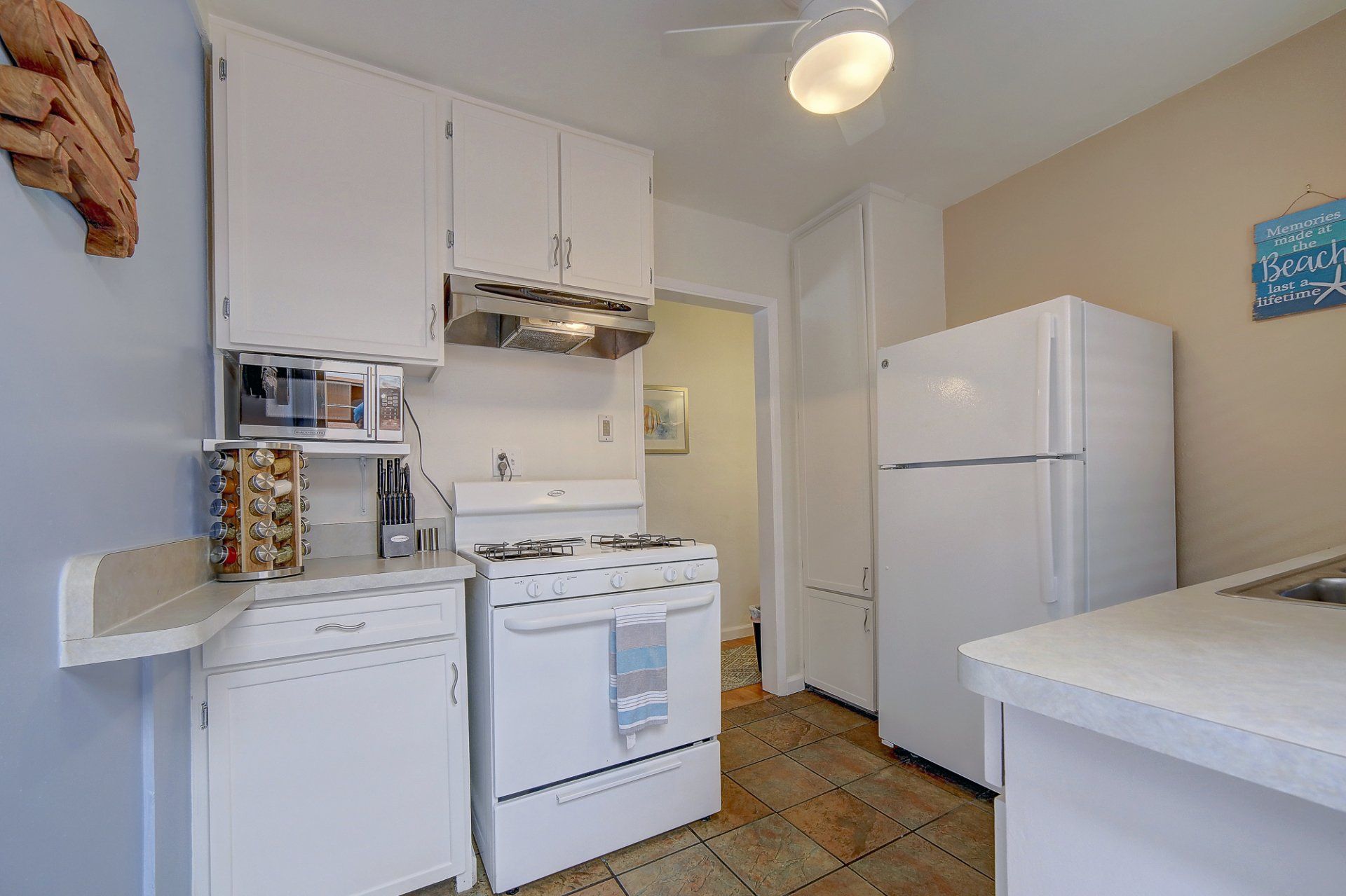 A kitchen with a stove , refrigerator and dishwasher