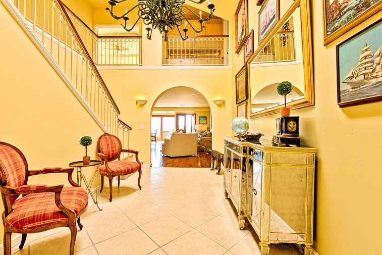 a hallway with a staircase leading up to the second floor of a house .