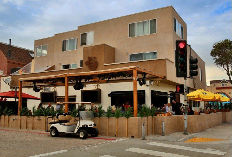 a golf cart is parked in front of a building