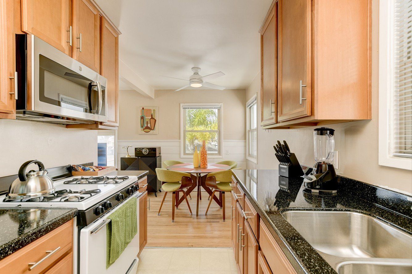 a kitchen with stainless steel appliances and granite counter tops