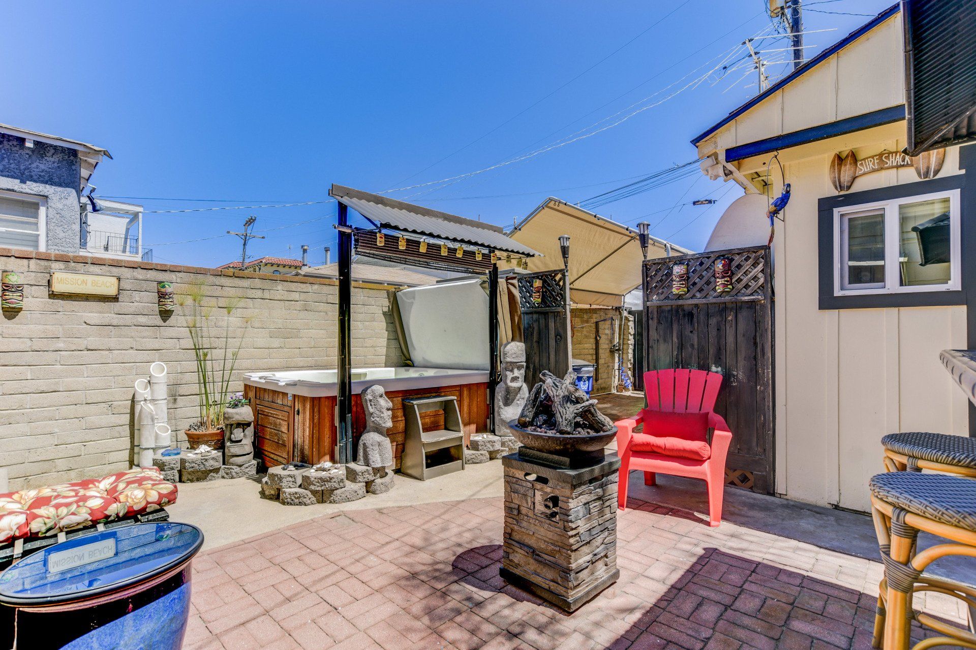 there is a hot tub in the backyard of a house .