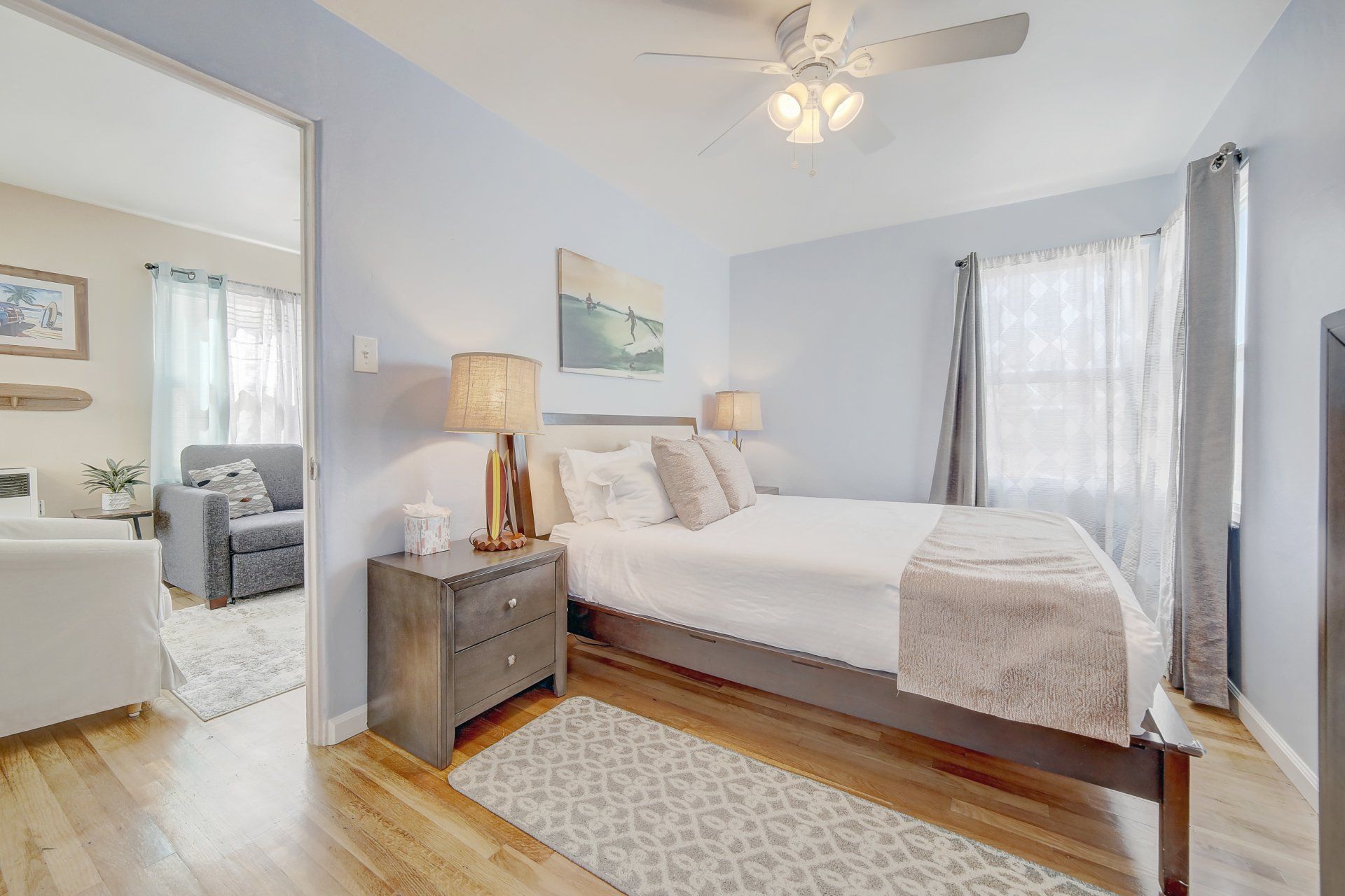 a bedroom with a king size bed and a ceiling fan .