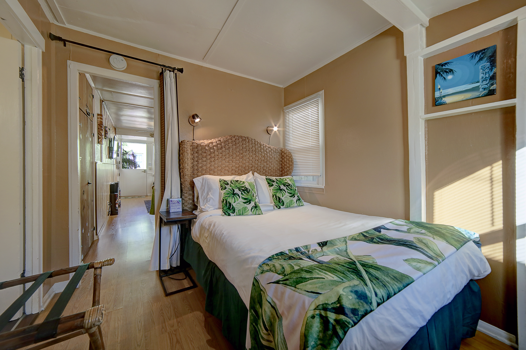 a bedroom with a king size bed and a chair .