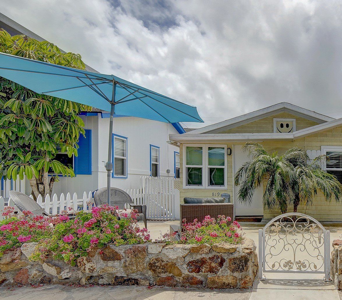 a house with a blue umbrella in front of it