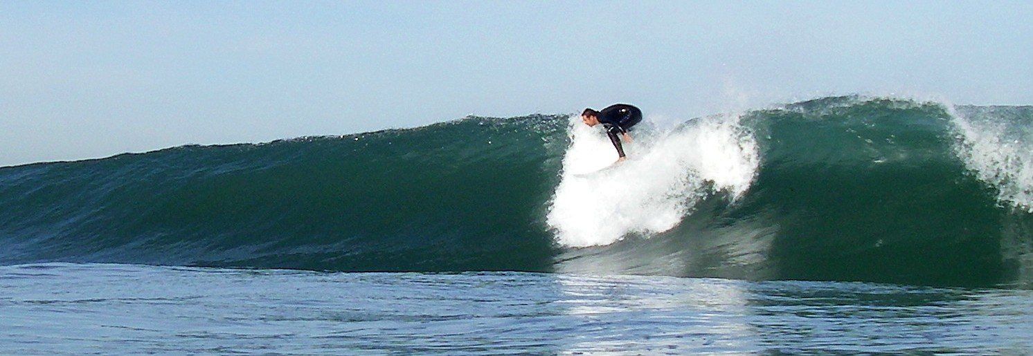 a surfer is riding a wave in the ocean .