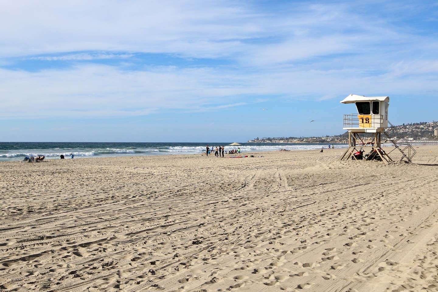 There is a lifeguard tower on the beach.