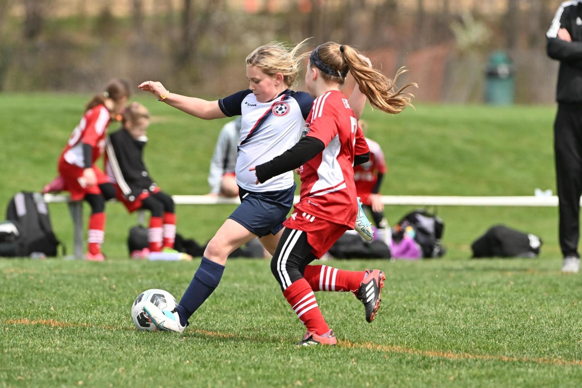 Clarke County Soccer League's female player taking a right footed shot at the top of the box. 