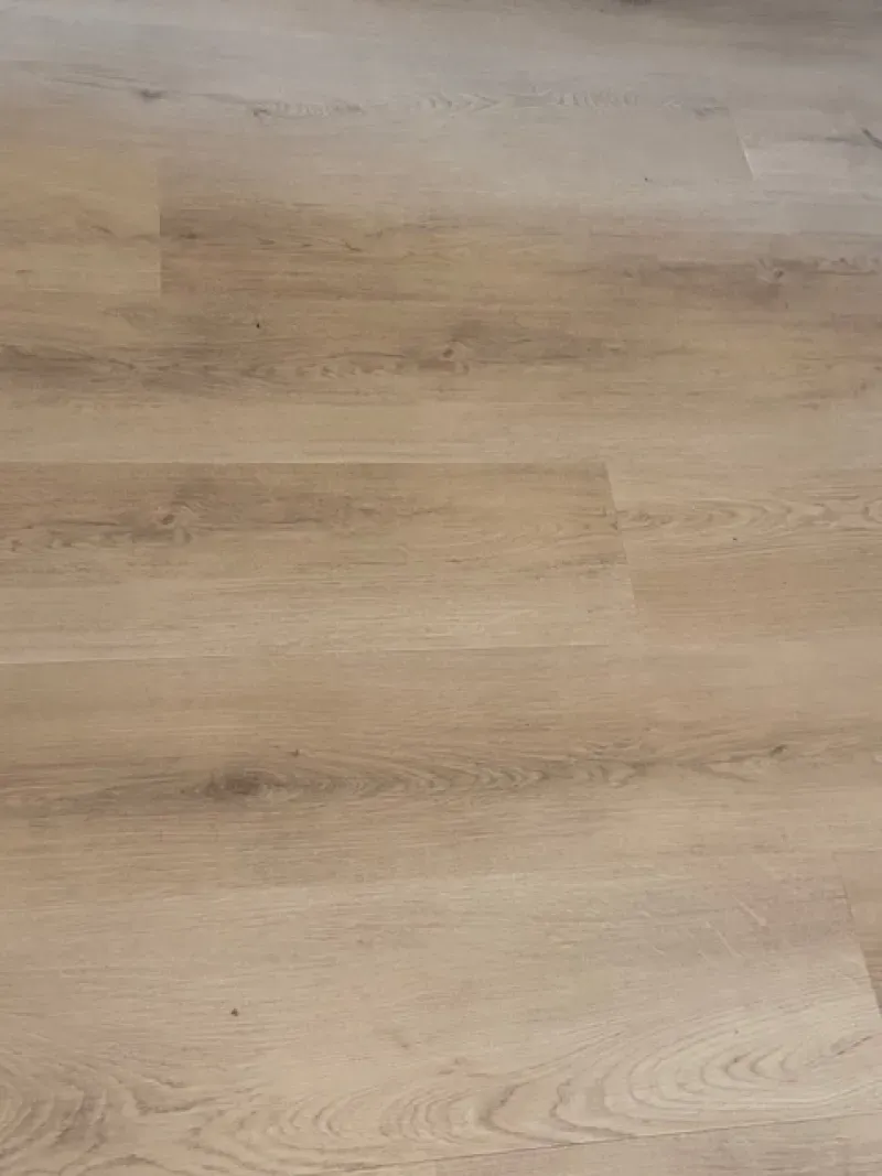 Light wood-grain flooring with subtle beige and tan tones