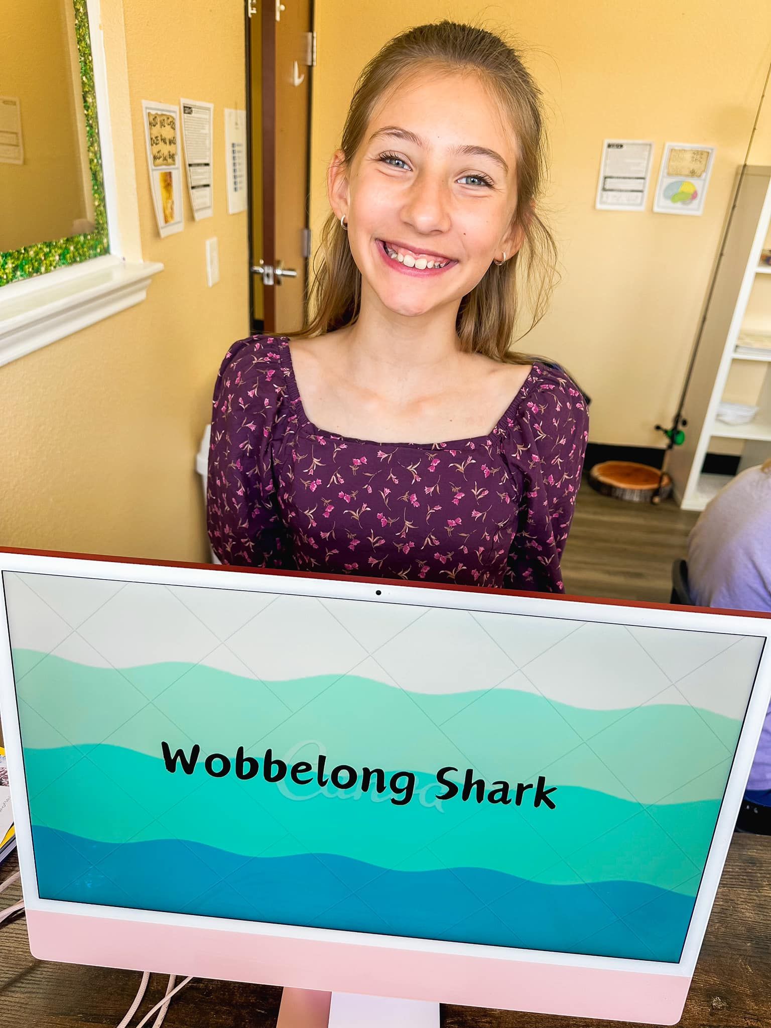 A teacher is giving a lecture to a group of students in a classroom.