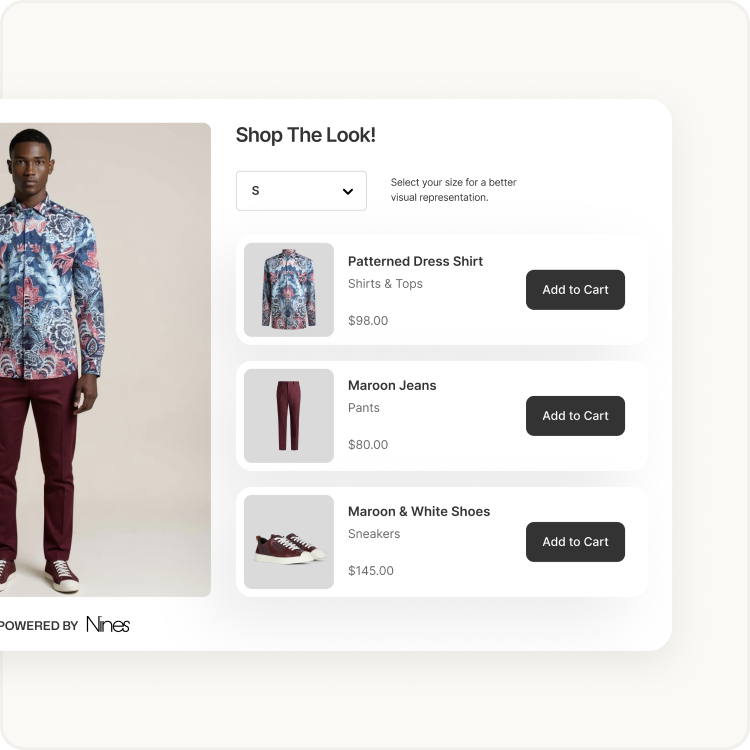 A man is wearing a floral shirt and maroon pants.