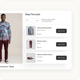 A man is wearing a floral shirt and maroon pants.