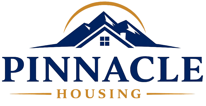 Logo for Pinnacle Housing featuring a navy blue mountain range and roof silhouette with a gold arch and text below.