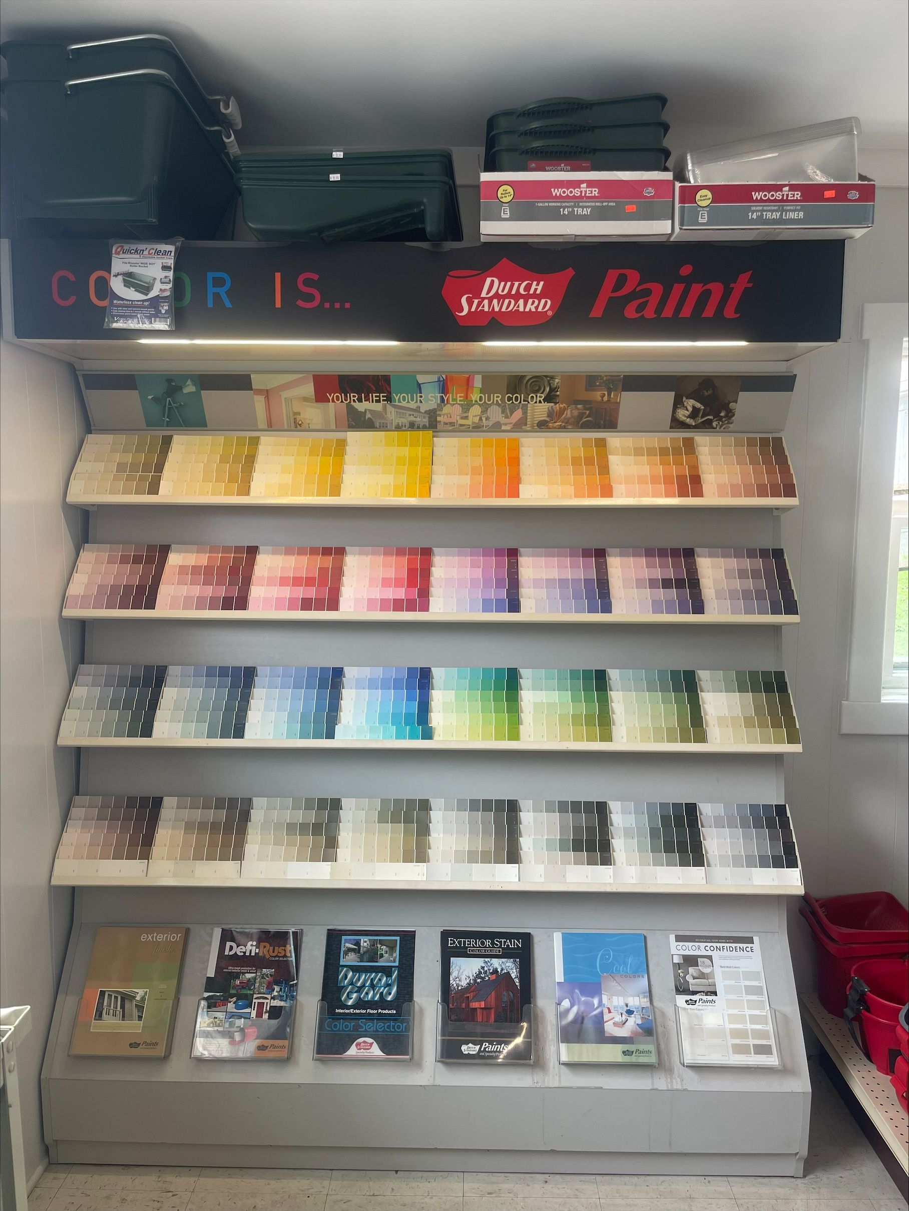 A display case filled with lots of different types of paint.