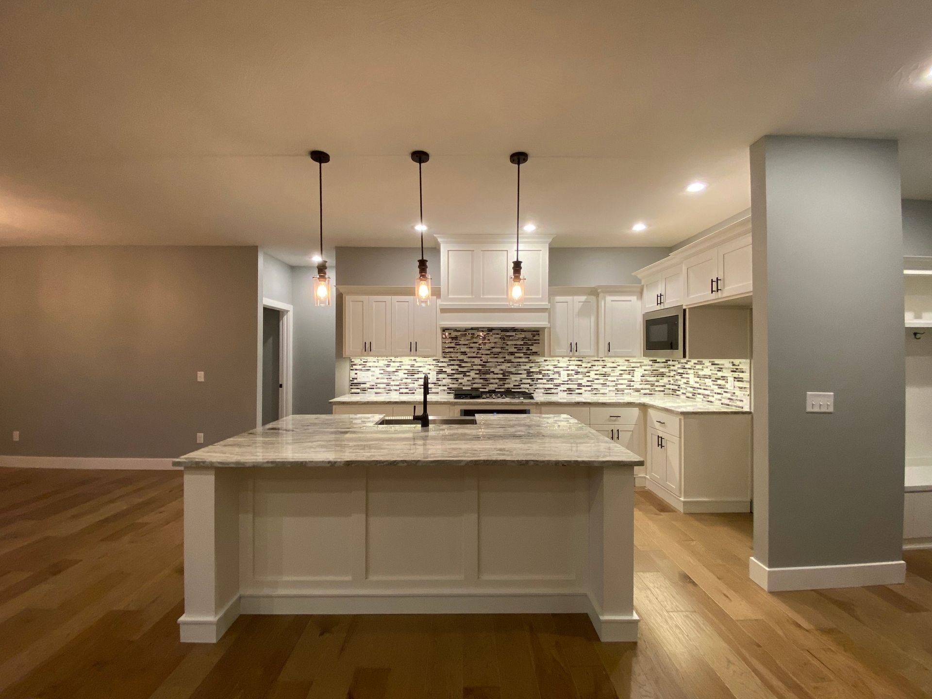 There is a large island in the middle of the kitchen.