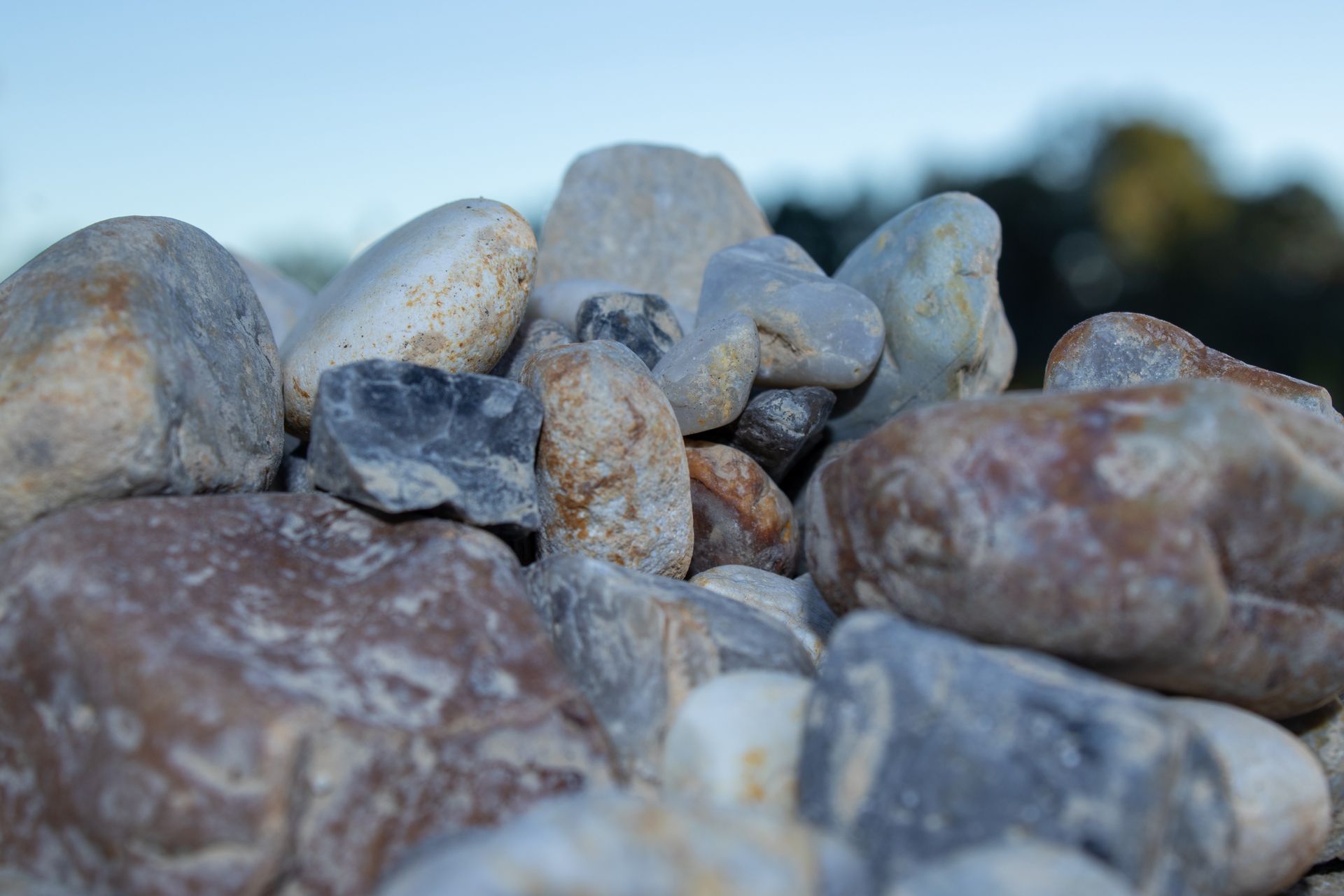 A pile of rocks with a blue sky in the background.