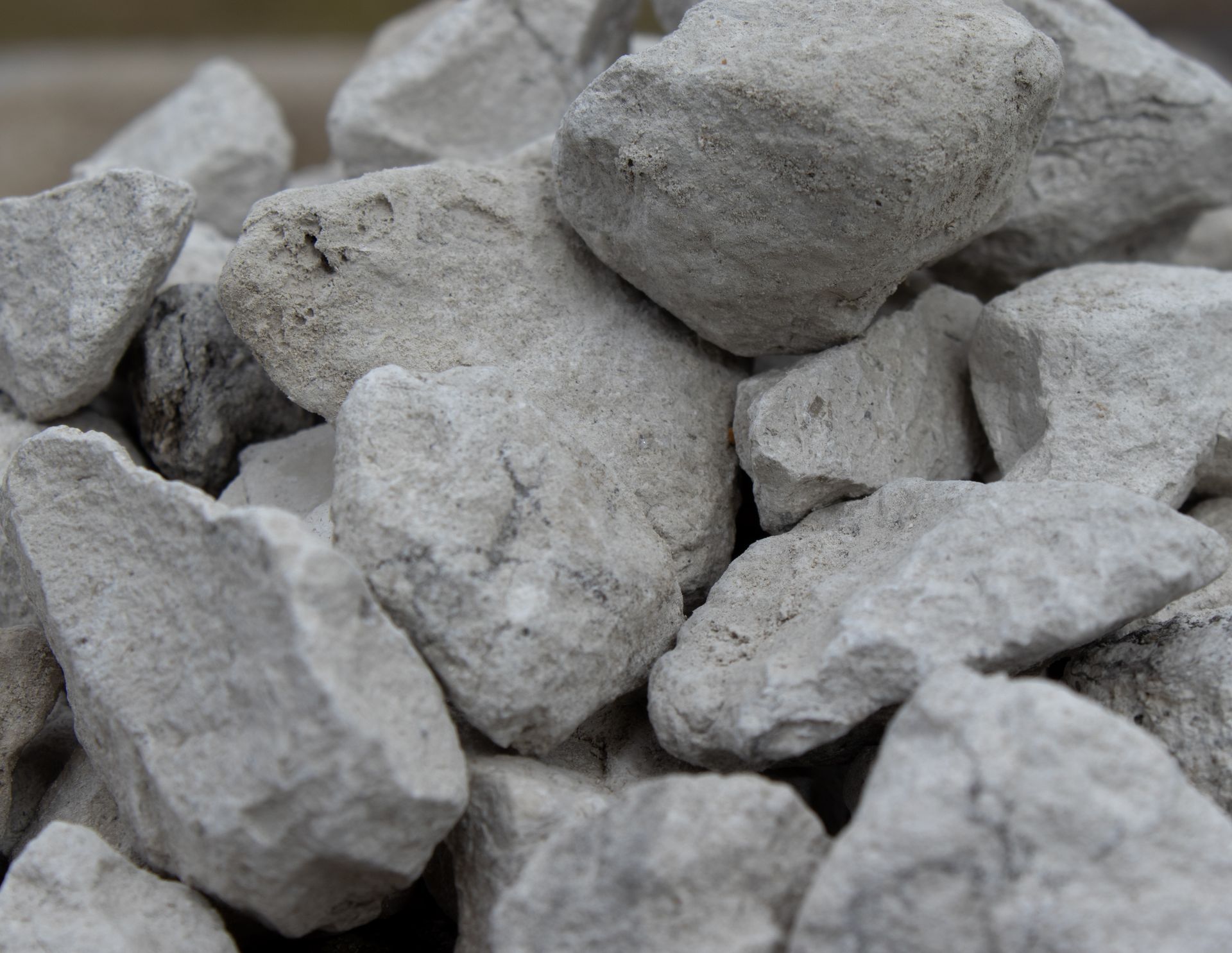 A pile of white rocks sitting on top of each other on a table.