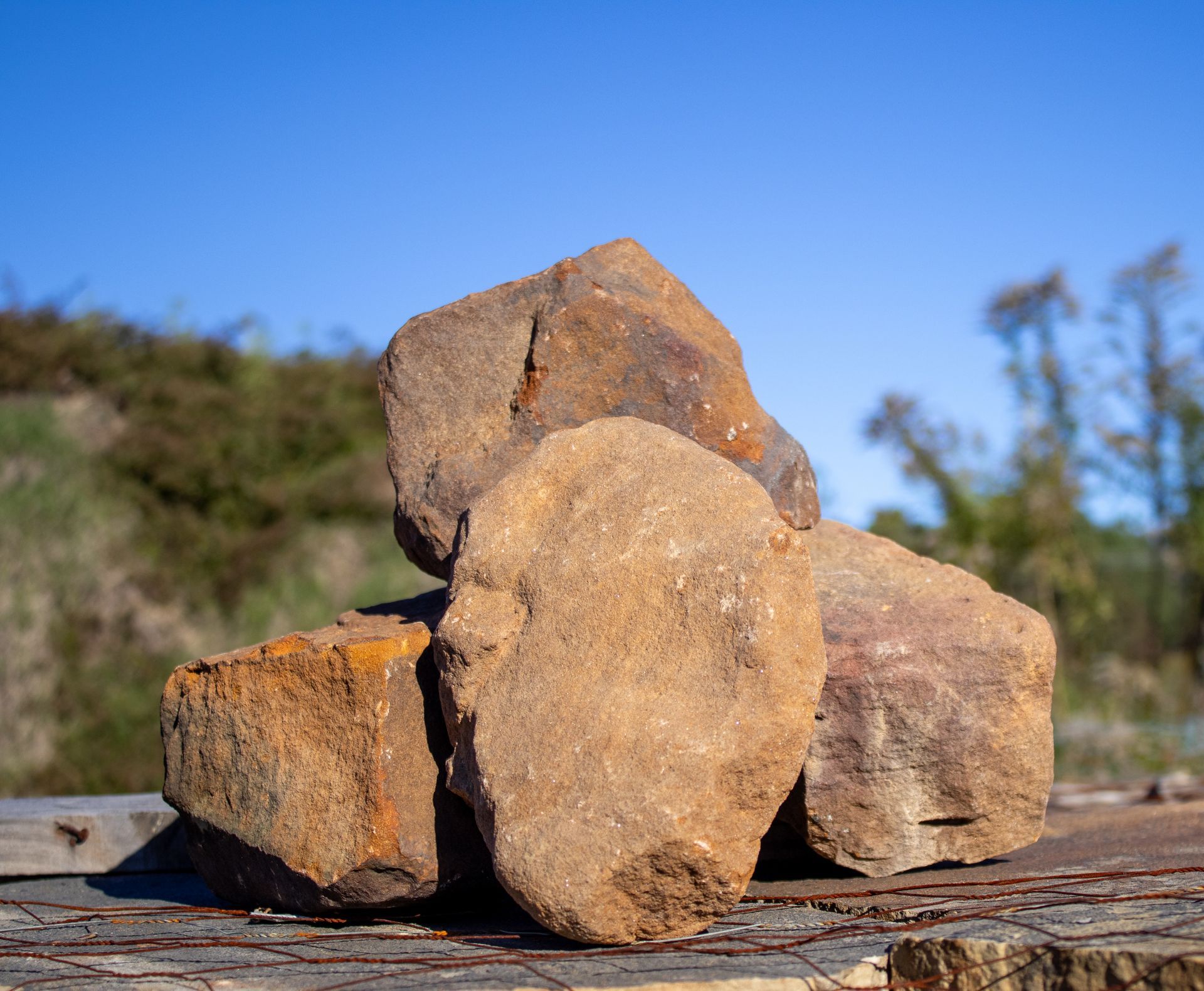 A pile of rocks sitting on top of a wooden table