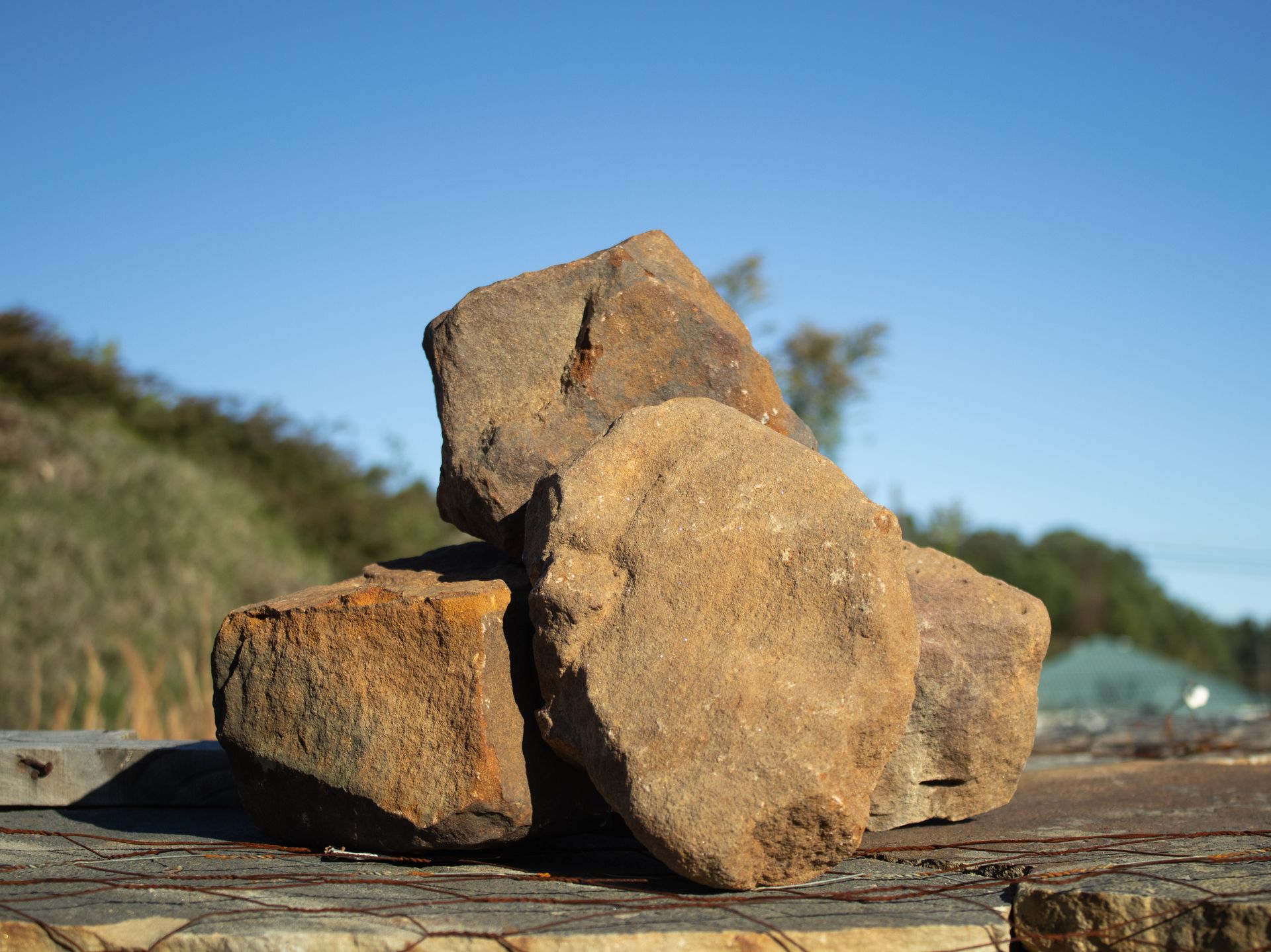A pile of rocks sitting on top of a wooden table.