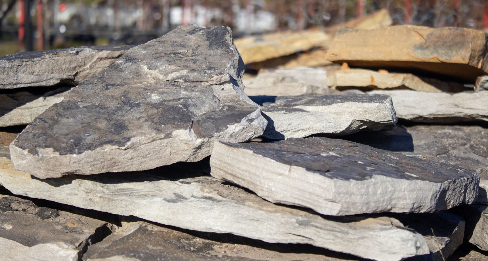 A pile of rocks sitting on top of each other on a sunny day.