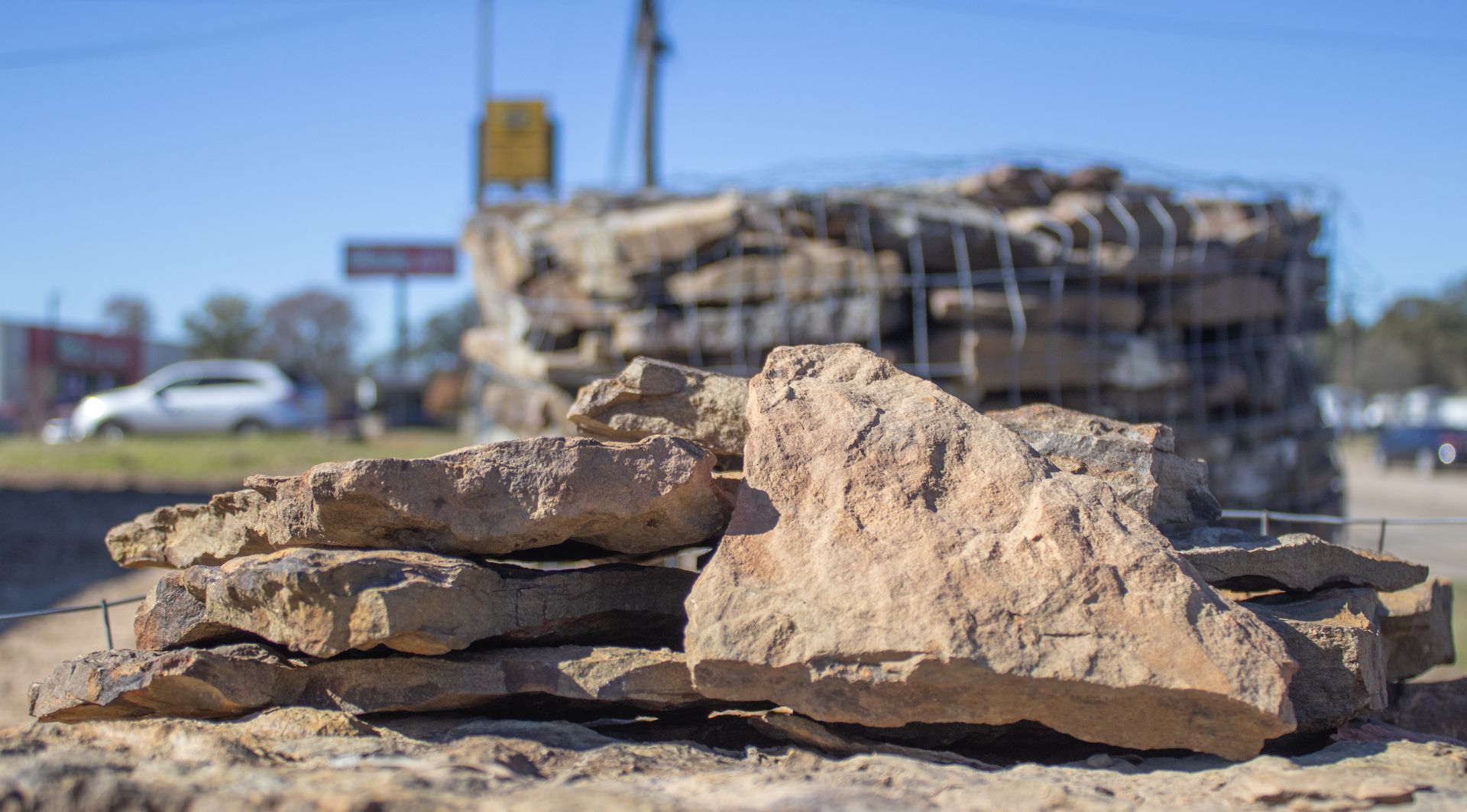 A pile of rocks sitting on top of a pile of dirt.