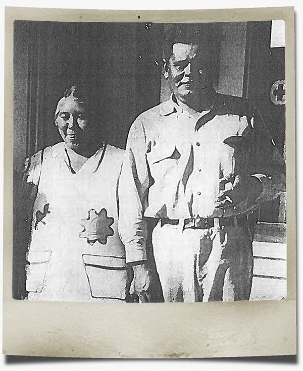 A black and white photo of a man and a woman