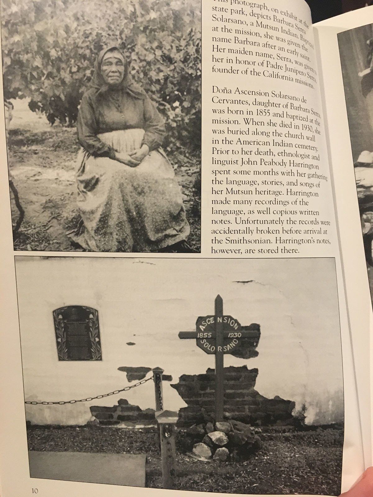 A book is open to a page with a picture of a woman and a cross