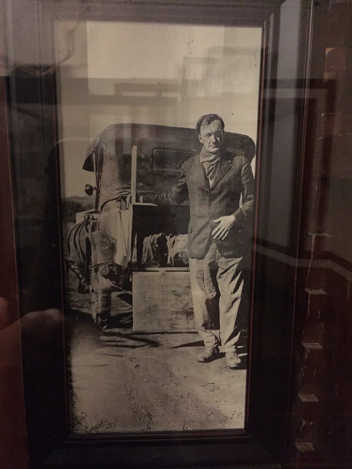A black and white photo of a man in a suit