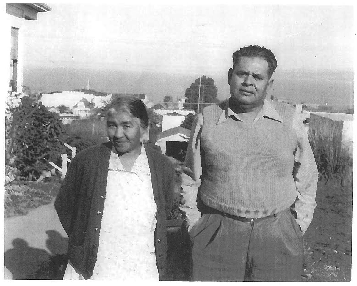 A black and white photo of a man and woman standing next to each other