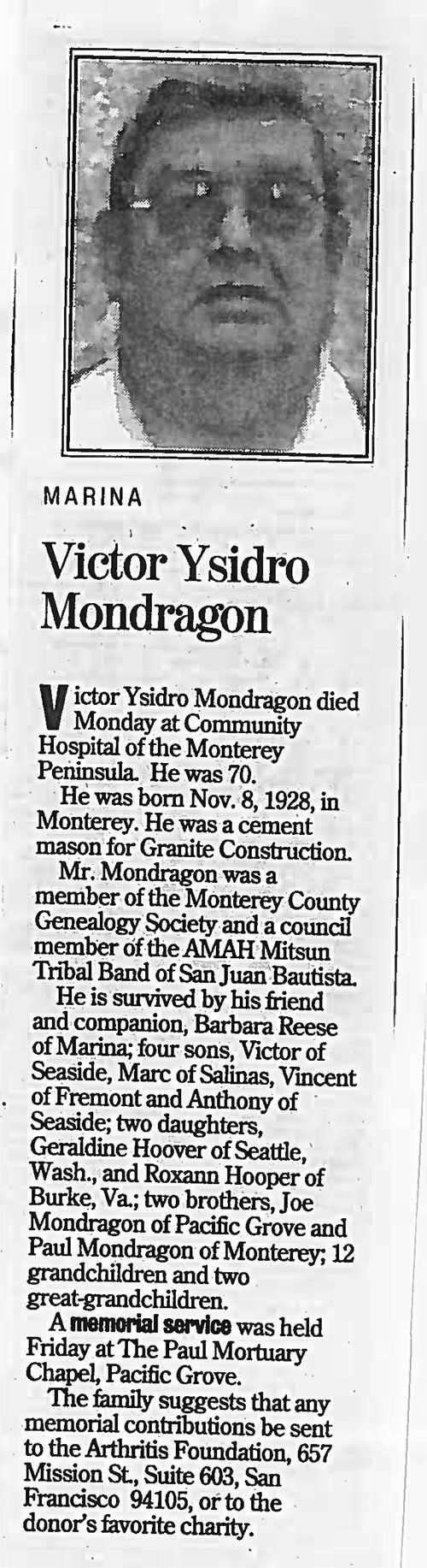 A black and white photo of a man wearing sunglasses