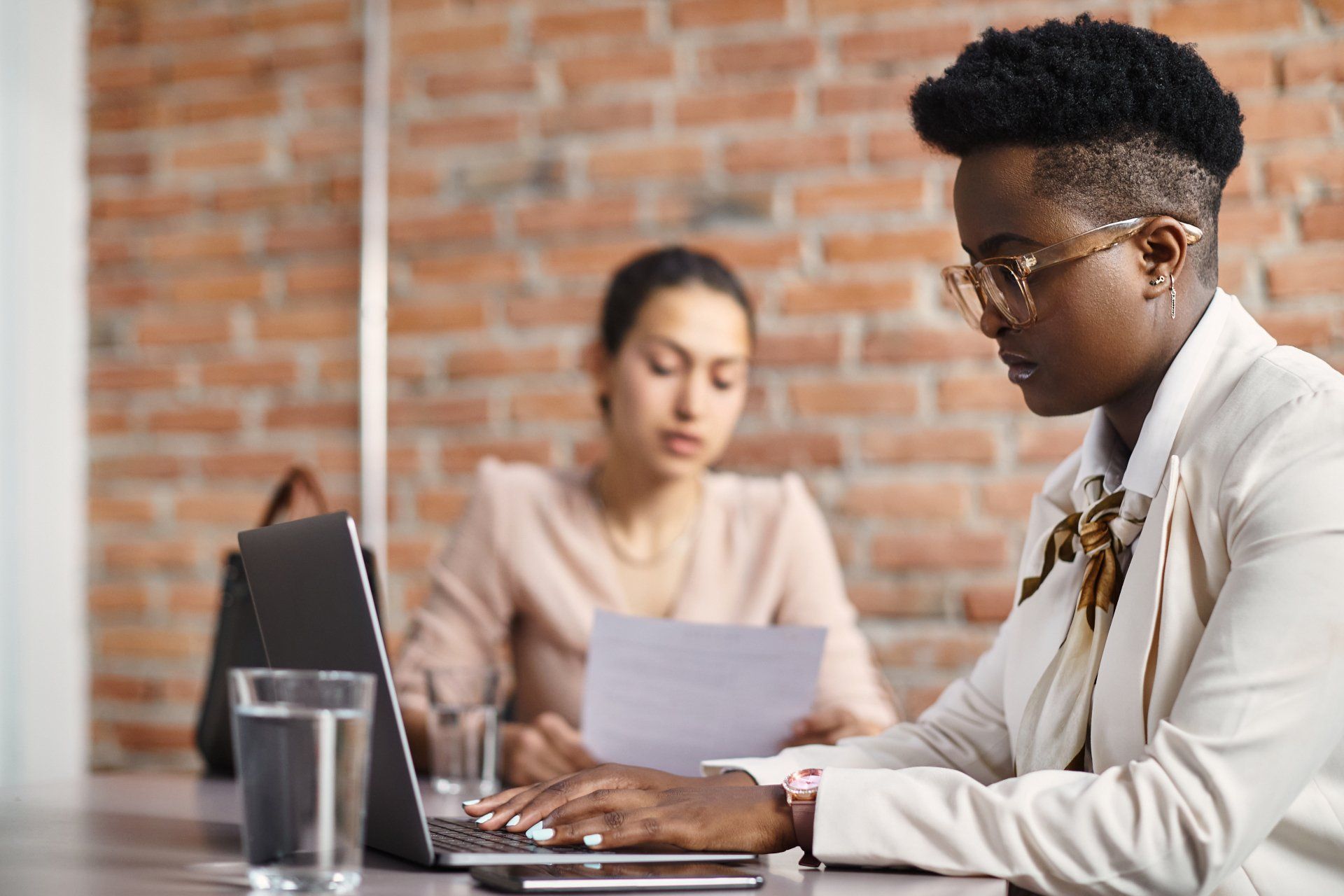 two-women-researching-through-database