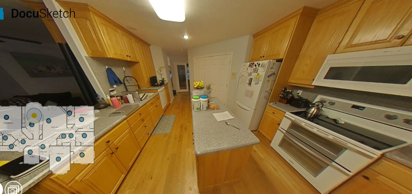 A kitchen with wooden cabinets , a stove , a refrigerator , and a microwave.