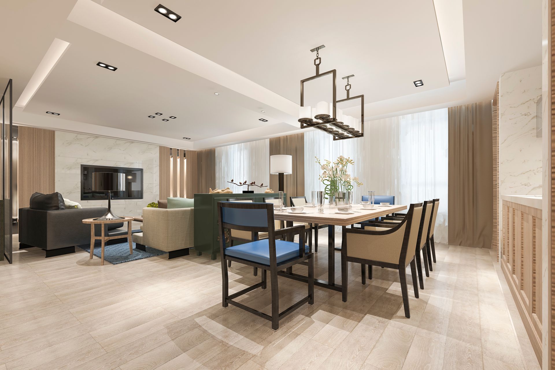 A dining room with a long table and chairs in a living room.