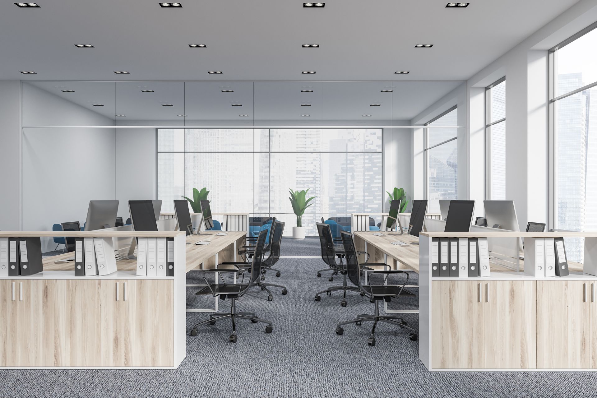 Bright open office with cubicles, desks, chairs, and large windows letting in natural light. Bright open office with cubicles, desks, chairs, and large windows letting in natural light.