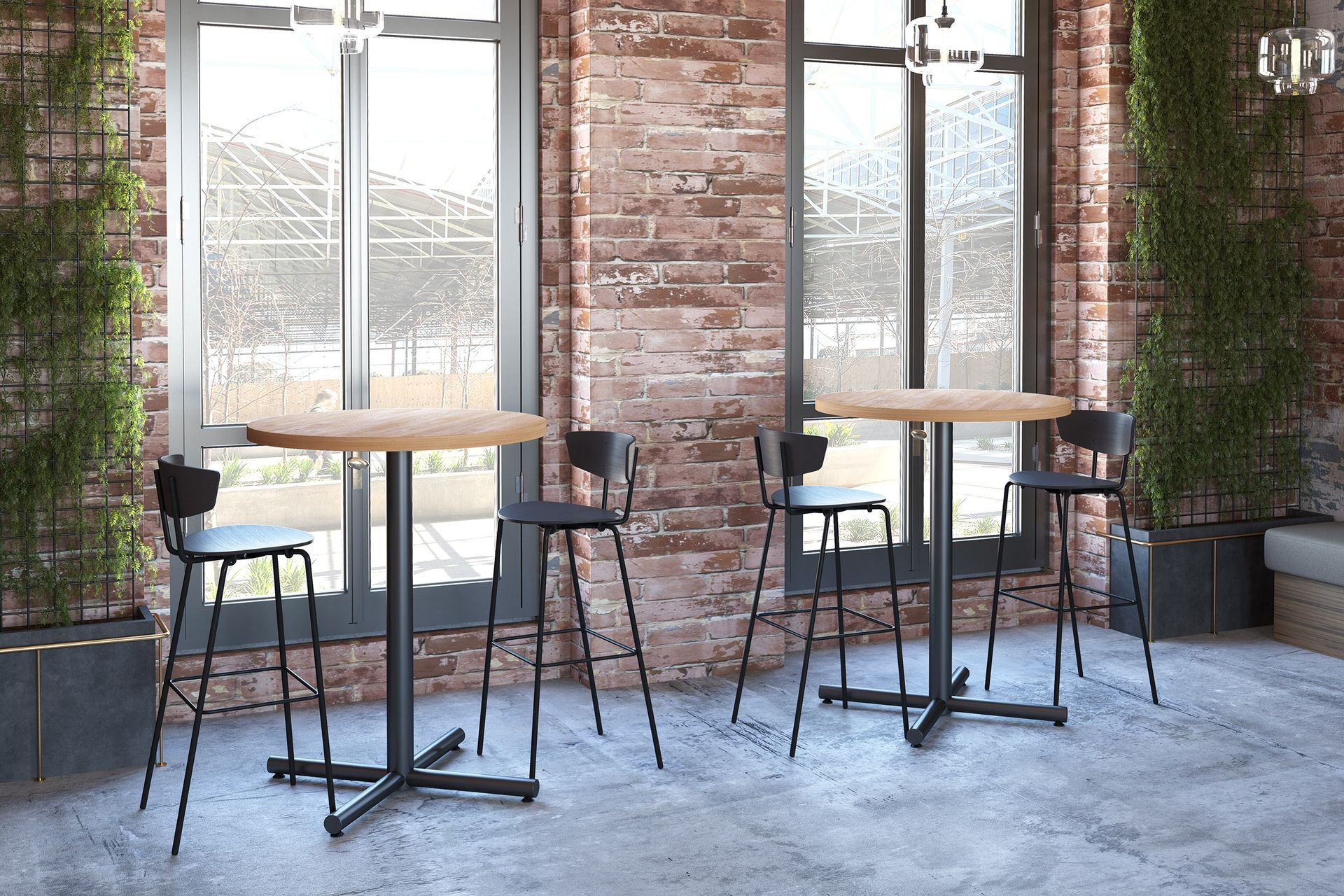 Two high top tables with black chairs, set in front of windows with brick walls and potted plants.