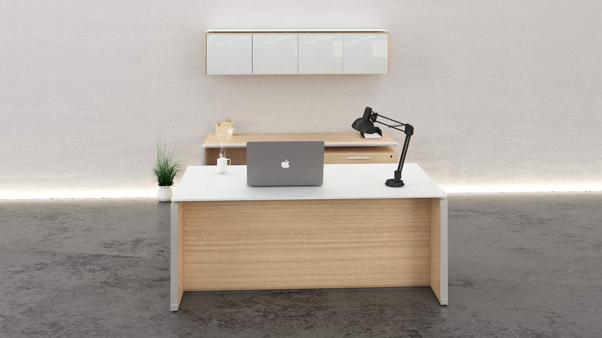 A modern office desk with a laptop and lamp. Light wood and white furniture with a white wall and gray floor.