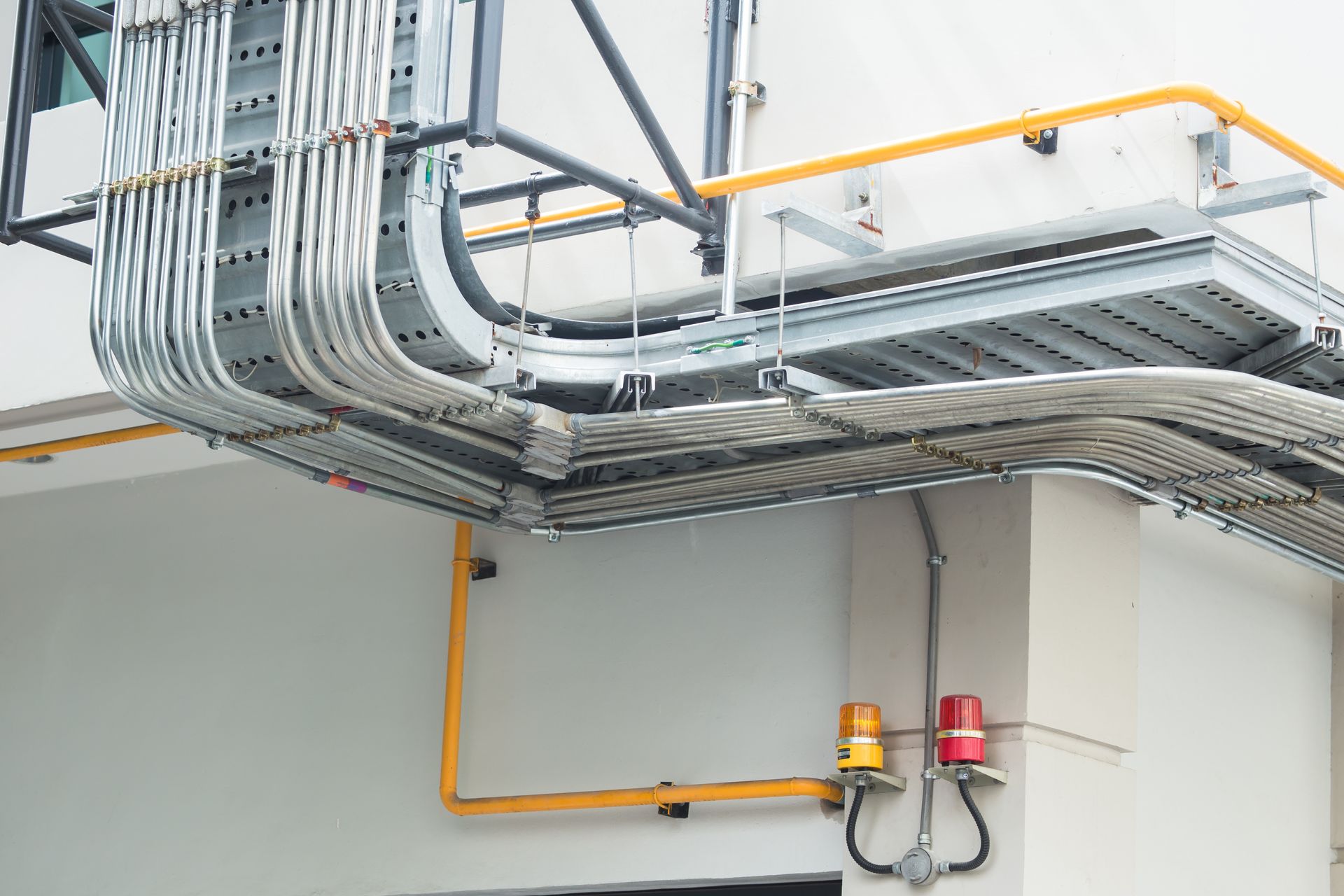 Metal flex pipe and outdoor conduit used for weatherproof cable management in an electrical network.