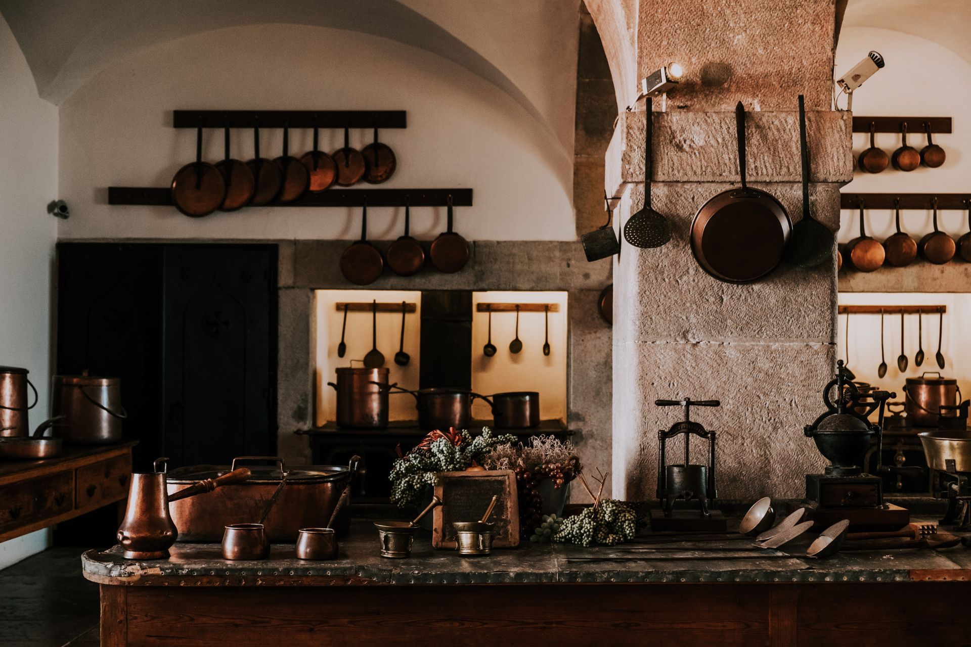 A cluttered kitchen filled with a variety of pots and pans.