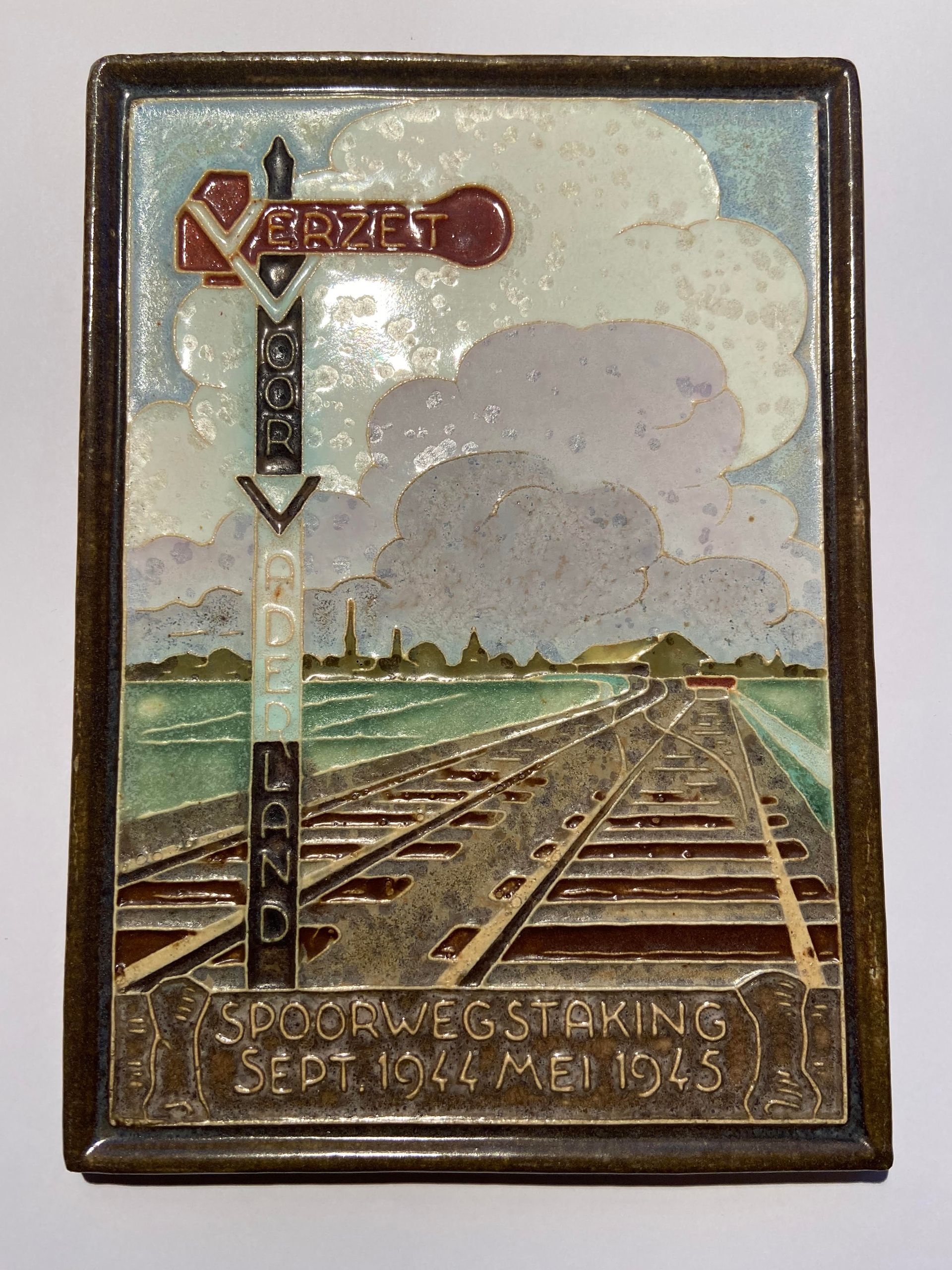 PFtile Porceleyne Fles Delft Cloisonne tile war and peace.