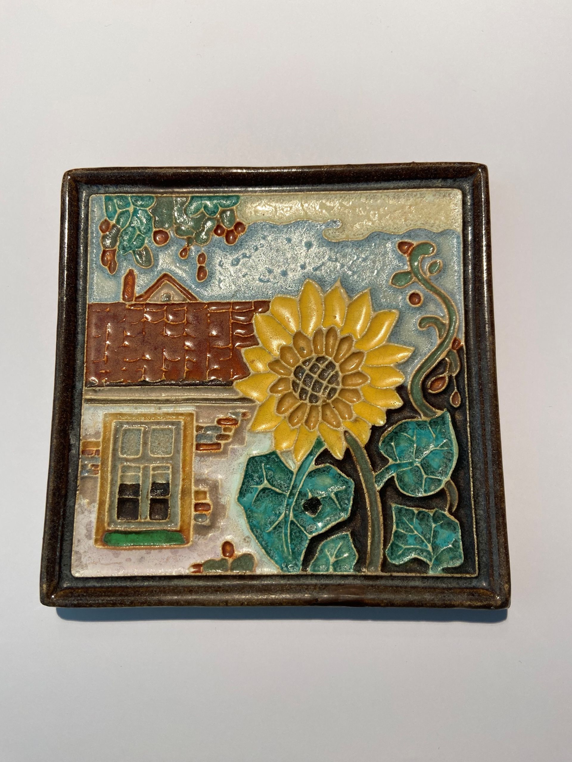 PFtegel Porceleyne Fles Delft Cloisonne tegel bloemen zonnebloem voor huisje.