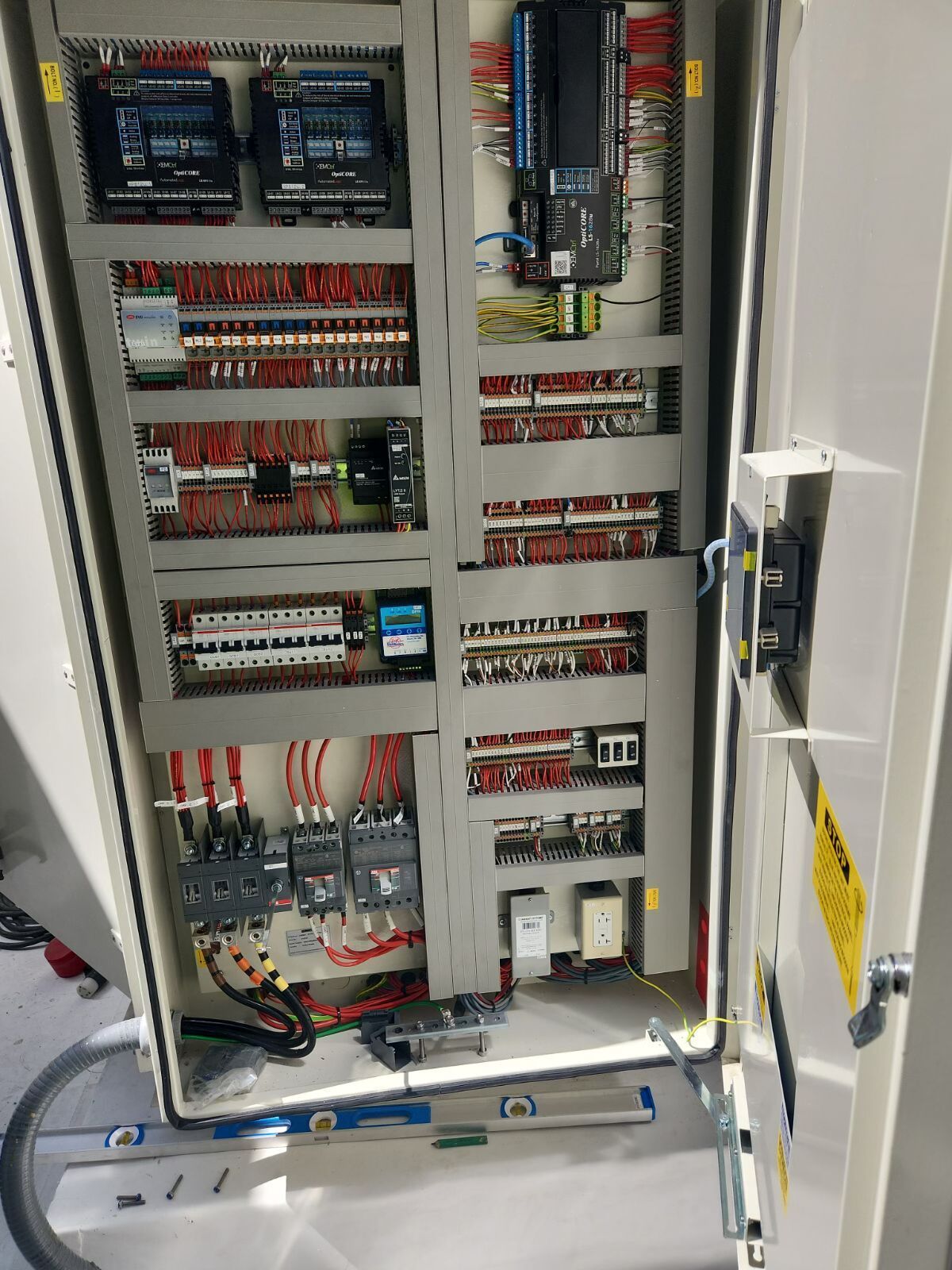 A large electrical box with a lot of wires coming out of it.