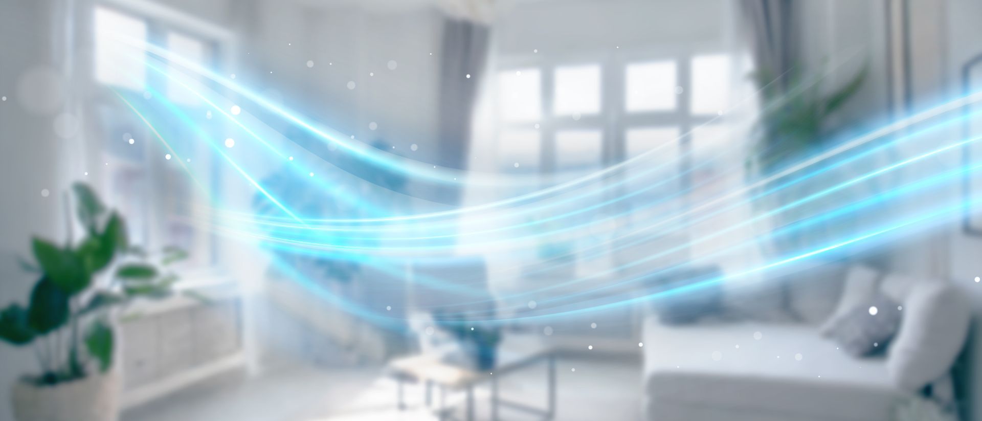 A blue air flow graphic moves through a blurred white living room, showcasing air purification concept.