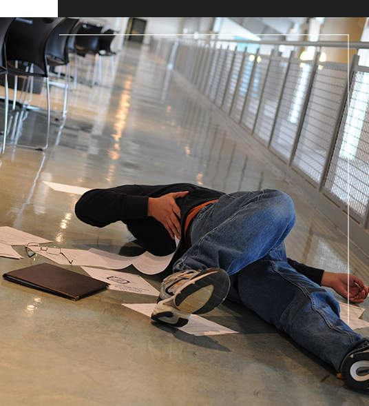 Slip and Fall, man on floor with papers all around him