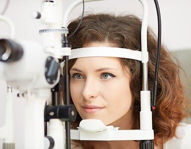 Eye Exams — Woman Taking Eye Exams in Archbold, OH