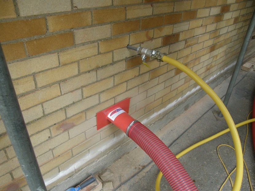 cavity wall insulation being extracted
