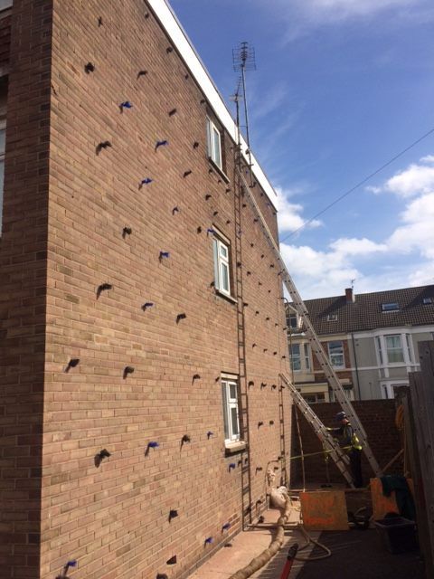 ladder against brick wall