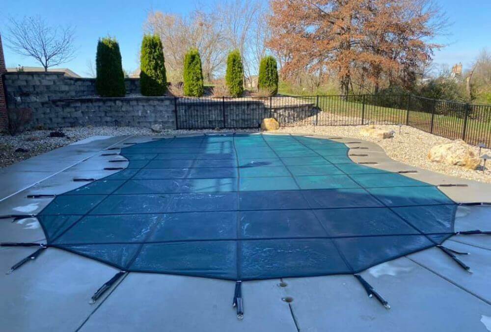 Custom sized pool with a cover in a residential area