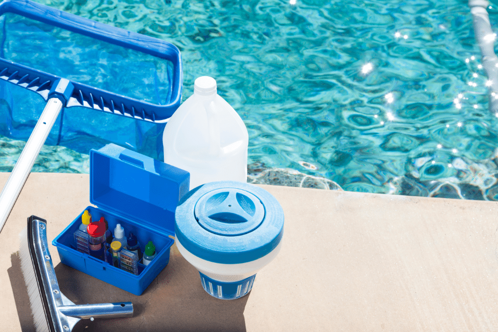Chemicals and Pool Maintenance Tools beside a swimming pool