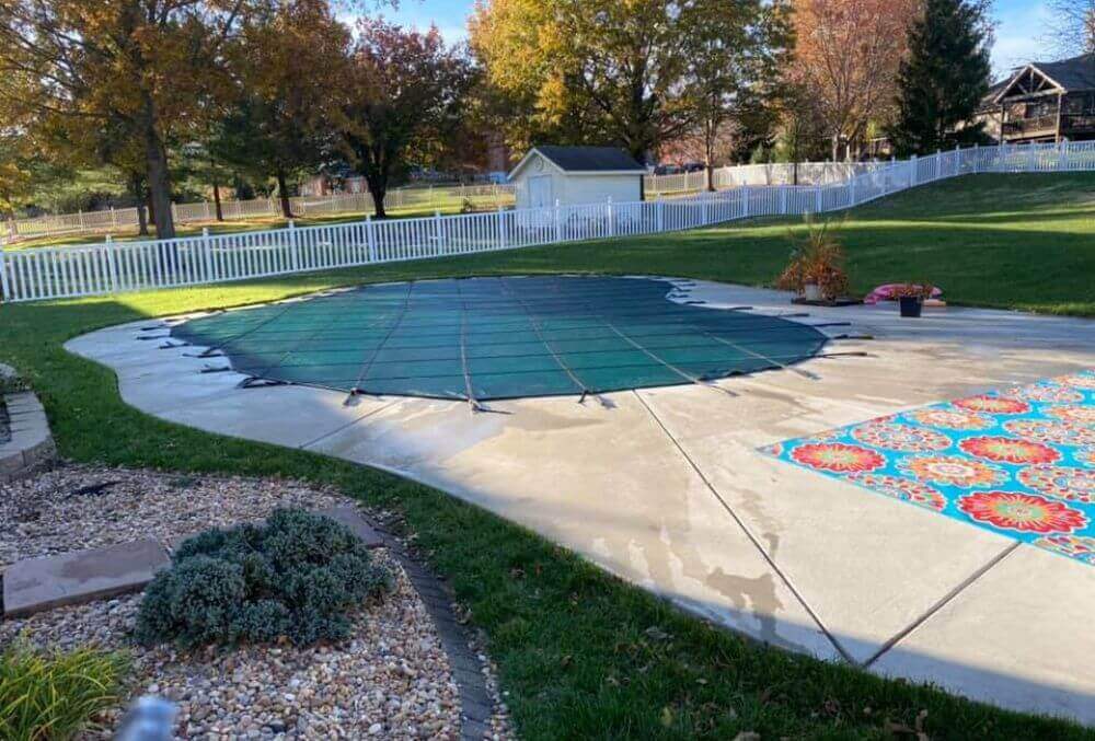 Kidney shaped residential pool wit covering
